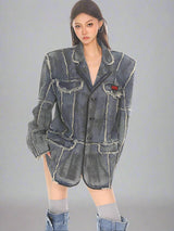 Distressed washed denim blazer with raw edges