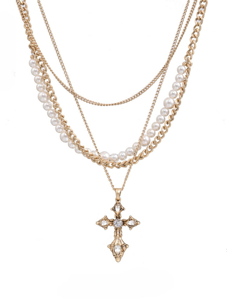 Multi-layered pearl cross necklace